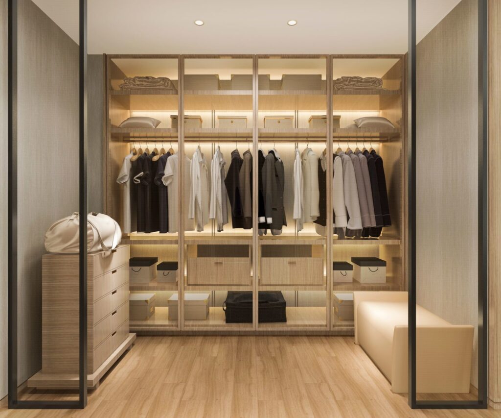 Clozitivity closet space with accent lighting and clothing